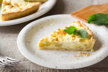 Pie with zucchini, cheese and mint on the table