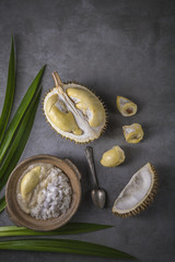 Fototapeta na wymiar Sweet Sticky Rice With Durian And Coconut Milk Sauce