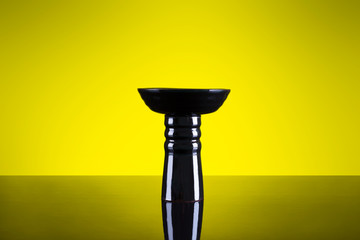 Hookah black bowl isolated on yellow background