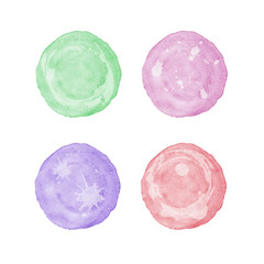 Green, purple, red and pink circle watercolor painting textured on white paper isolated on white background