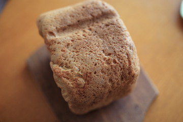 a loaf of home bread on a wooden cutting board