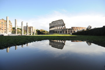 Colosseum in rome reflected in the water