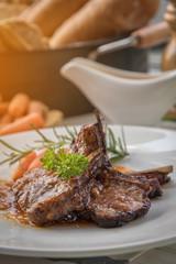 lamb steak on white plate