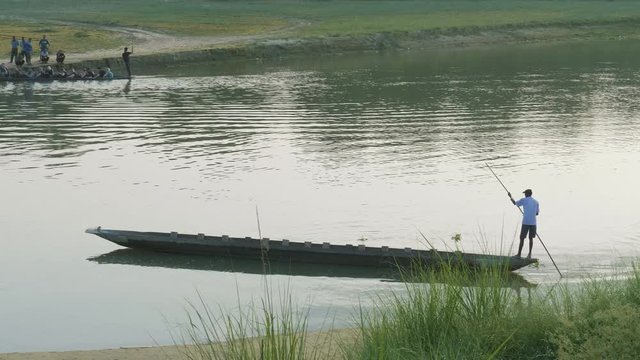 Canoeing on the river in the national park Chitwan, Nepal.