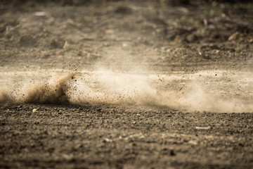 dirt fly after motocross roaring by
