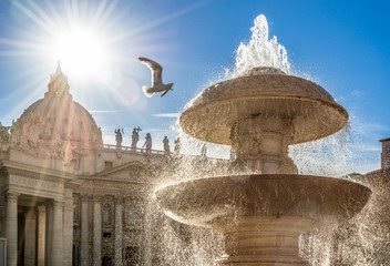 Saint Peter fountain of papal Basilica in Vatican at sunset, Rome, Italy Europe. Rome Saint Peter Square in Vatican is a famous landmark and attraction of Rome and Italy