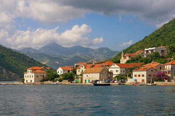 Fototapeta na wymiar Beautiful Mediterranean landscape with small seaside village. Montenegro, Bay of Kotor, Lepetane village