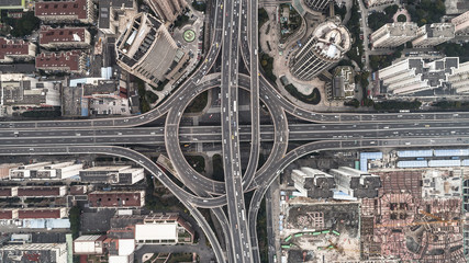 Aerial view of highway and overpass in city on a cloudy day