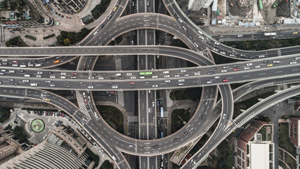 Aerial view of highway and overpass in city on a cloudy day