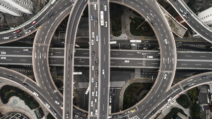 Aerial view of highway and overpass in city on a cloudy day