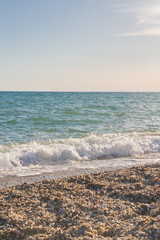 The sea shore at summer Sunny day just before sunset