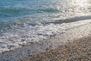 The sea shore at summer Sunny day just before sunset