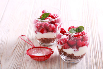 Raspberry layered dessert served in glasses