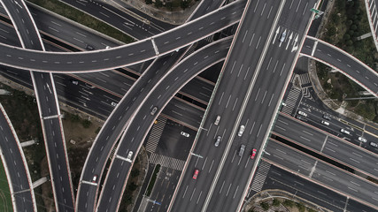 Aerial view of highway and overpass in city on a cloudy day