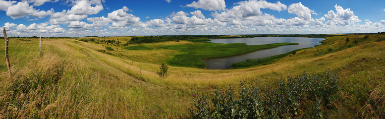Fototapeta na wymiar Panorama of summer landscape with pond in Russia