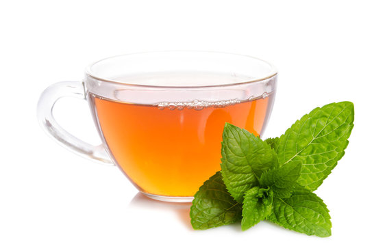 Glass cup of Tea with mint leaves  on table