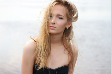 portrait beauty girl on beach. and wind in hair