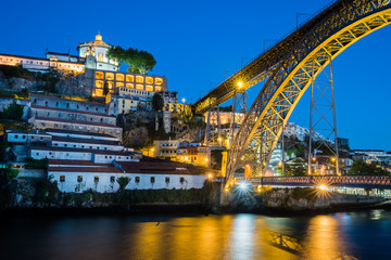 Evening view of Dom Luis Bridge in Porto, Portugal.
