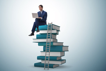 Businessman in telelearning concept with laptop