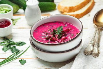 Cold fresh traditional vegetable summer soup made of beetroot (beet), cucumber, dill, parsley, green onion, eggs and sour cream (kefir). Holodnik. borsch