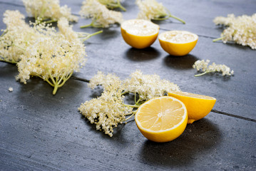 elder flower juice ingredients on  black wood table background