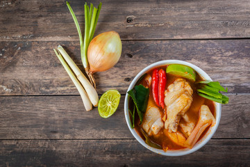 Chicken tom yam  in a hot white bowl to eat.