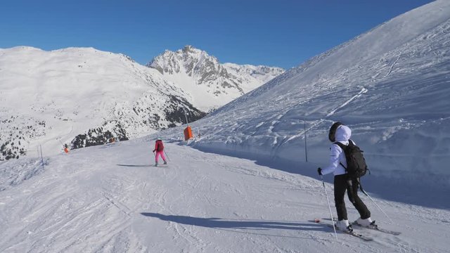 Two Skier Woman Skiing Carving Style On The Mountain Slope In Winter
