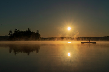 Fototapeta na wymiar Maine lake sunrise in the morning