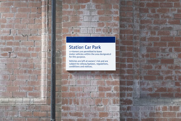 train station car park sign brick wall railway facilities