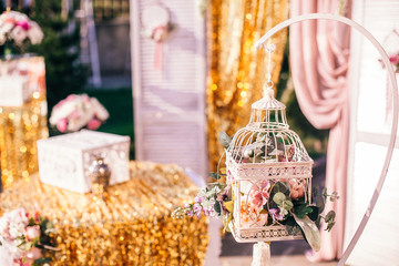 Wedding Banquet hall decorated with flowers, table setting, floral arrangements in the restaurant.