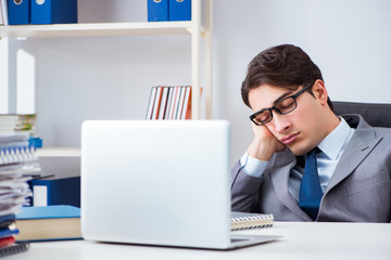 Unhappy businessman working in office