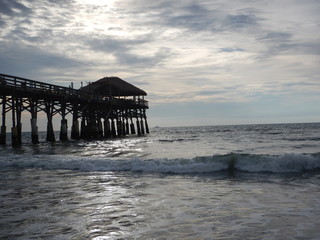 The view of Cocoa Beach Pier on a cloudy day on the beach in Florida