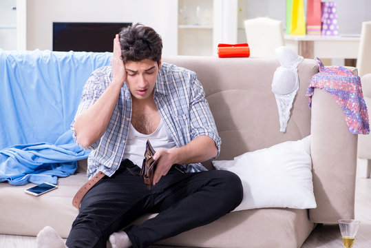 Man with mess at home after house party