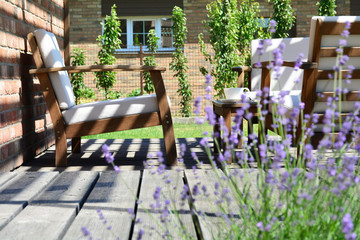 Provence style tea time in the modern backyard garden terrace surrounded by lavender