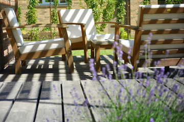 Fototapeta na wymiar Provence style tea time in the modern backyard garden terrace surrounded by lavender