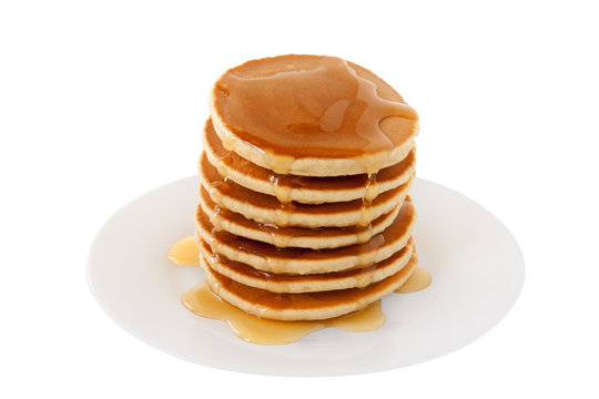 Stack of Pancakes with maple syrup on a plate isolated white background. Breakfast. Brunch. Dessert. Snacks. Family Food. Sweets. Fat Tuesday.