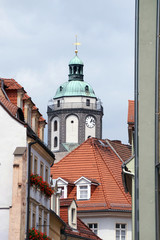 Fototapeta premium View of elegant streets of Meissen with a beautiful Church of our Lady and tiled roofs, Saxony, Germany, vertical image