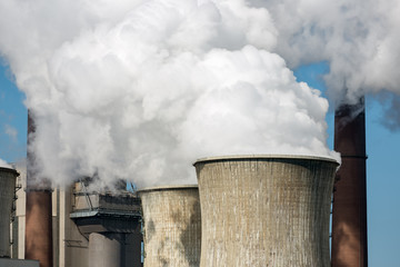 Cooling towers and smokestackss coal fired power plant near lignite mine Garzweiler in Germany