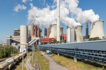 Cooling towers and smokestacks coal fired power plant near lignite mine Garzweiler in Germany