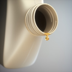 Last drop of oil falling from inside the container. Concept image of the oil industry and its...