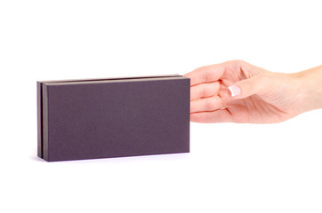 Black box in hand on white background isolation