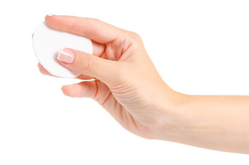 Wadded cotton pads in a hand on a white background isolation