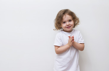 Smiling little girl in white shirt