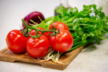 Image of a variety of colorful vegetables on a cutting wooden board