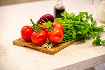 Image of a variety of colorful vegetables on a cutting wooden board