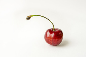 Berries of ripe cherries, one piece. Studio white background,