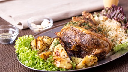 Tasty pork knuckle with  garnish.