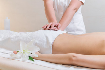 Down back massage at spa salon