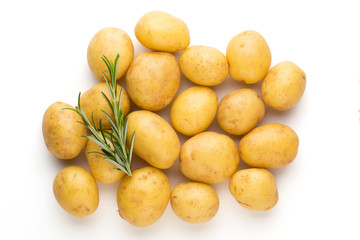 New potato and rosemarin isolated on white background close up.