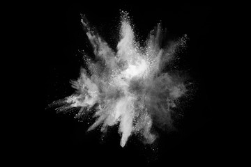 Launched white powder, isolated on black background.